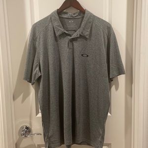 Oakley- Grey colored, 2 button collared Shirt.